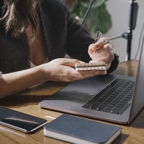 woman working on a laptop HXJ45V3